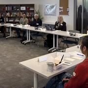 conference room with faculty and Documenters lead at The Beacon