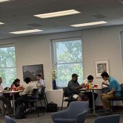 members of faculty sitting at high top tables in UMKC's Faculty Commons