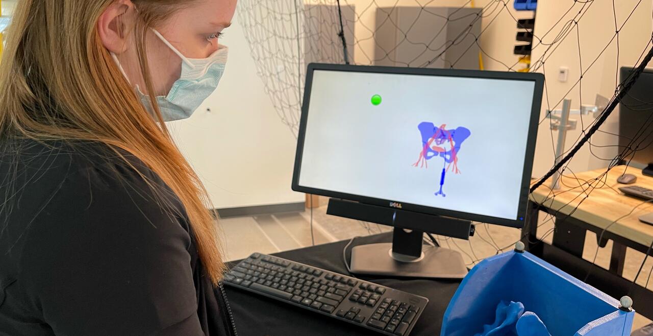 Student testing our pelvic model
