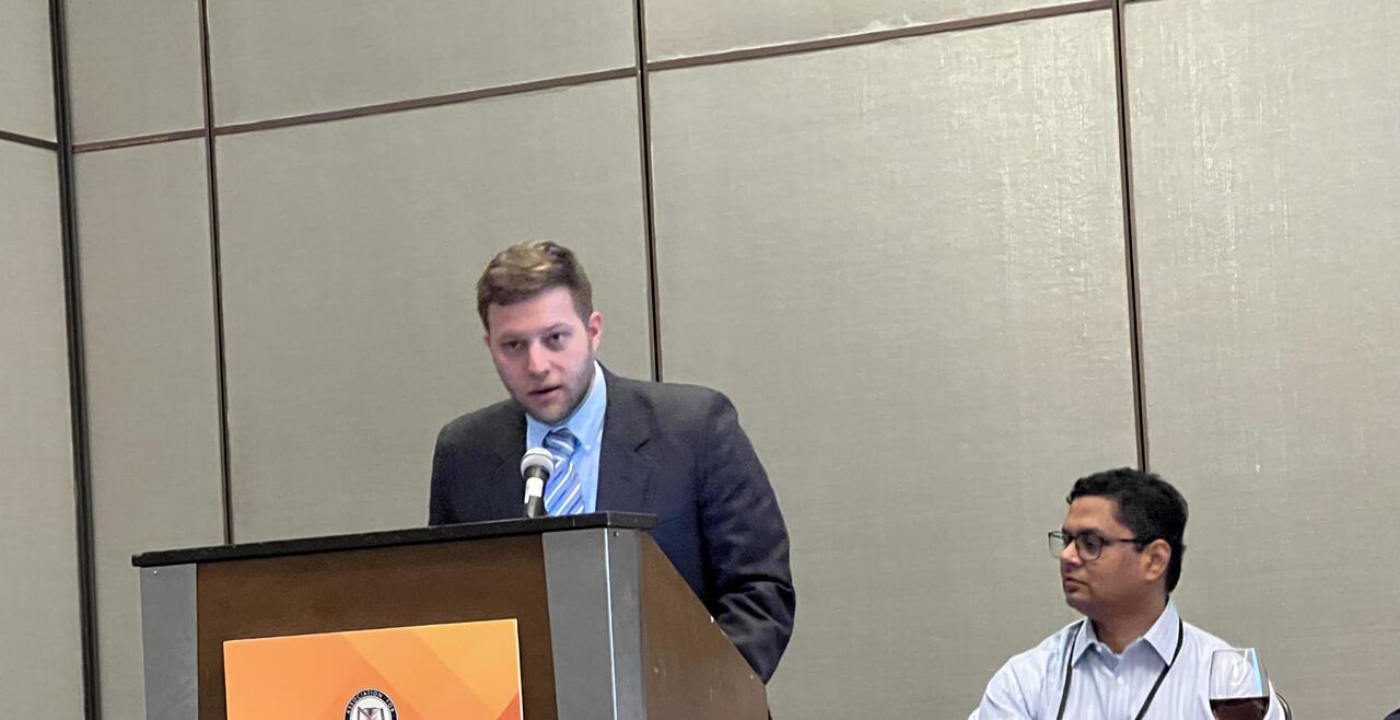 Image of Casey Rose at the podium 