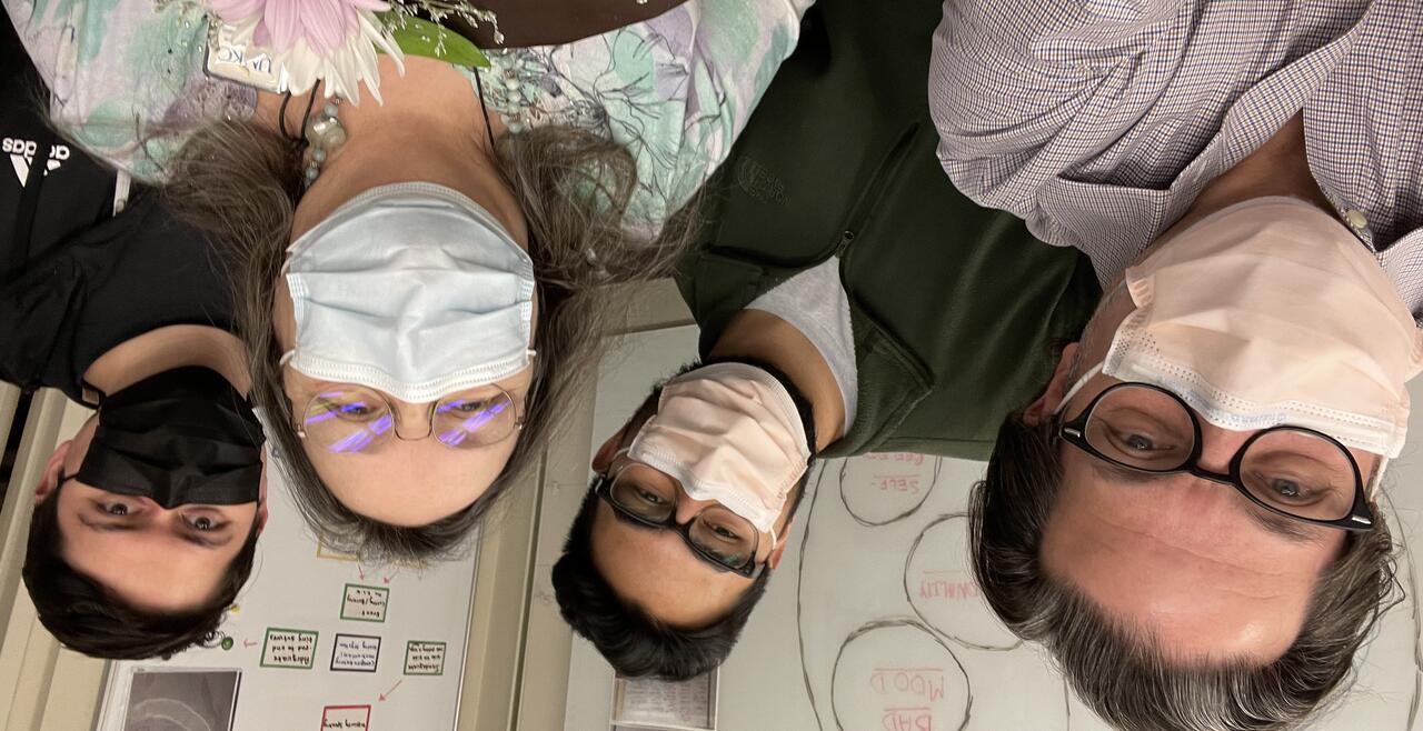 A group of people with masks on