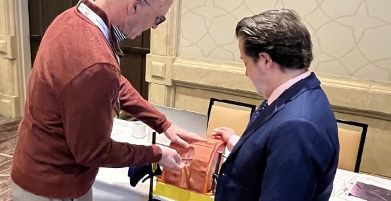 Image of two men at a simulation