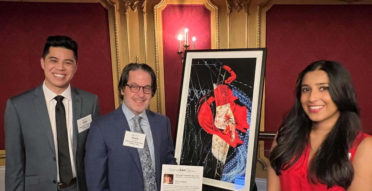 Peoplestanding next to artwork