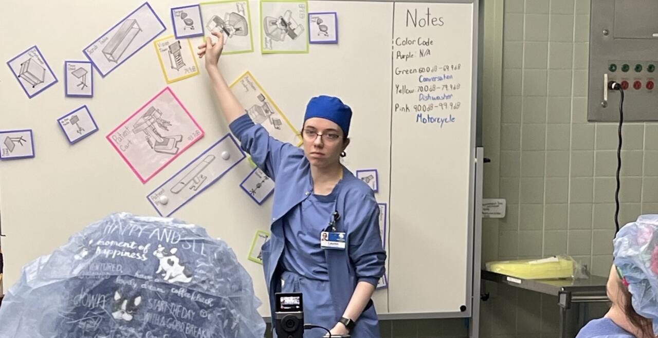 woman standing at white board