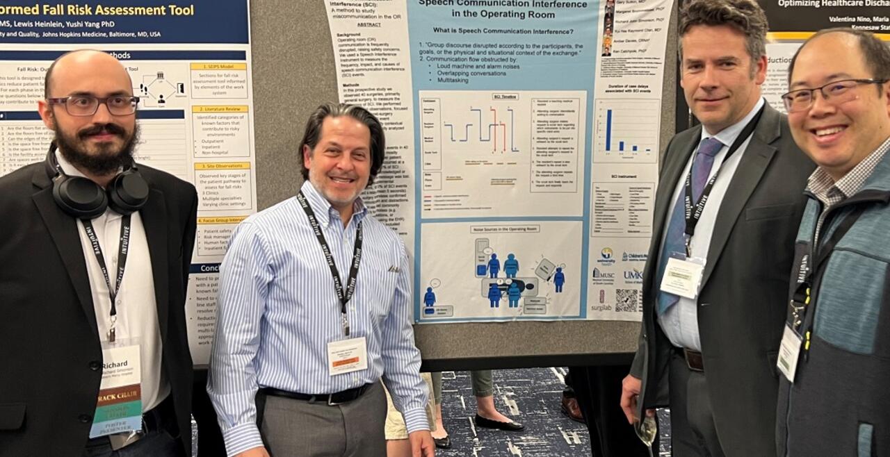 Image of authors with their poster